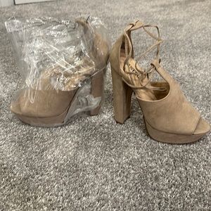 Never worn new in bag lace up open toe square heels.